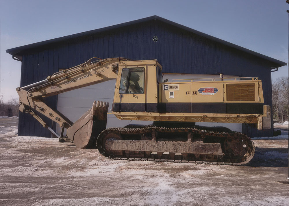 Excavator truck with professional equipment painting service in Auburn NH